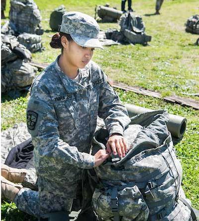 Female ROTC Student packing backpack